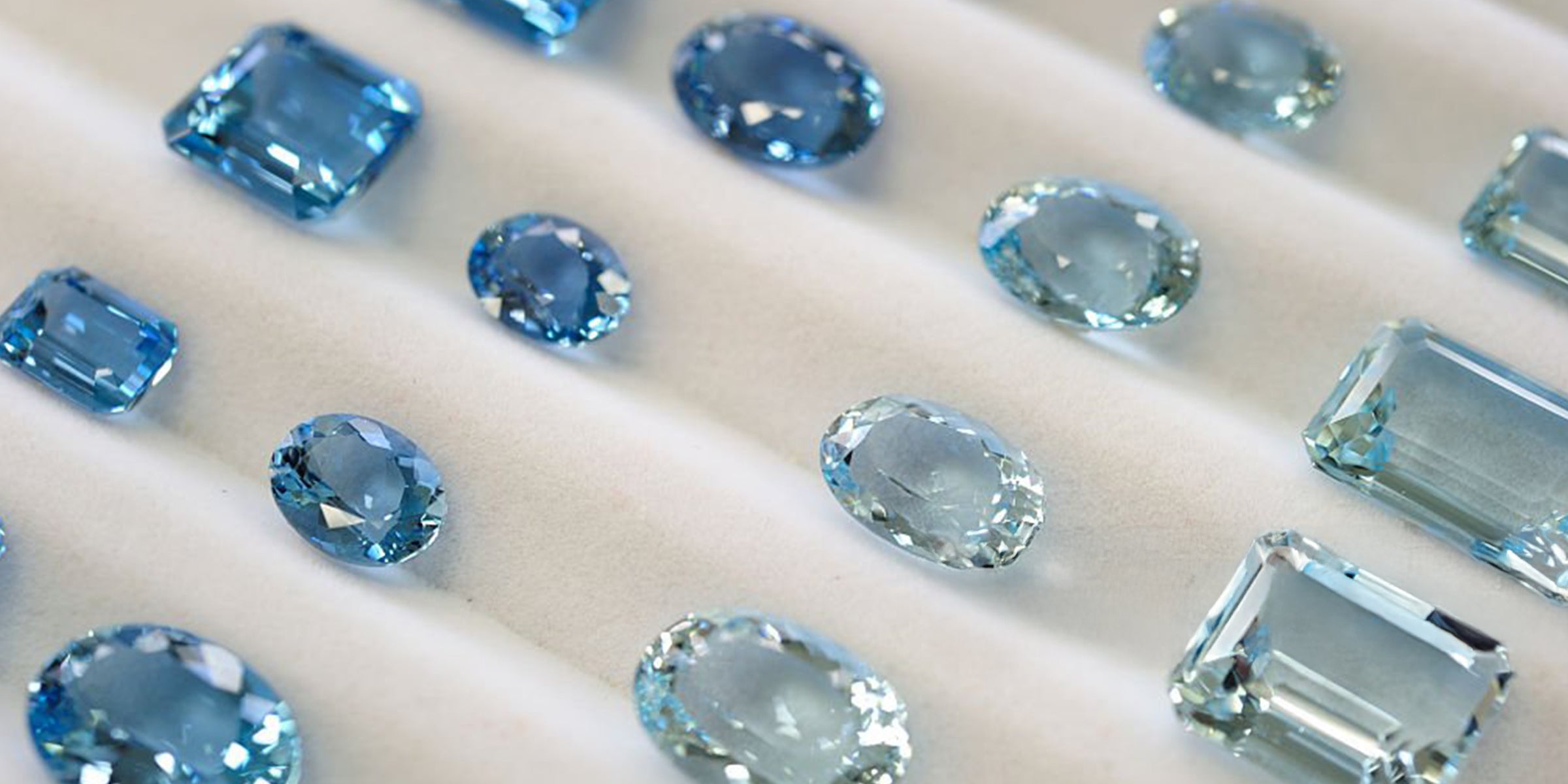 Gema lapidada água marinha de tonalidade azul claro a escuro em lapidação retangular, oval e redonda